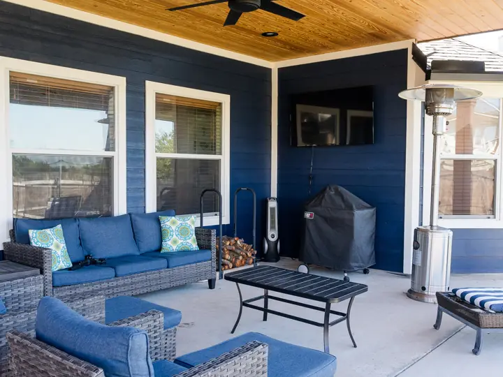 Covered back patio with cedar ceiling and outdoor seating