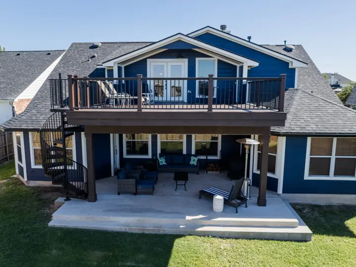 Rear elevation with new second-story deck, balcony, and covered patio in Austin, TX