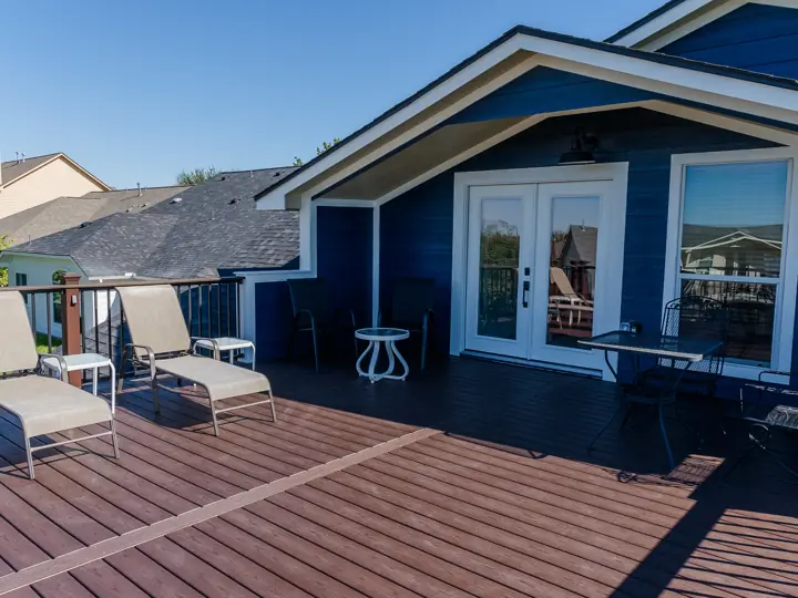 Composite second-story deck with black metal railing