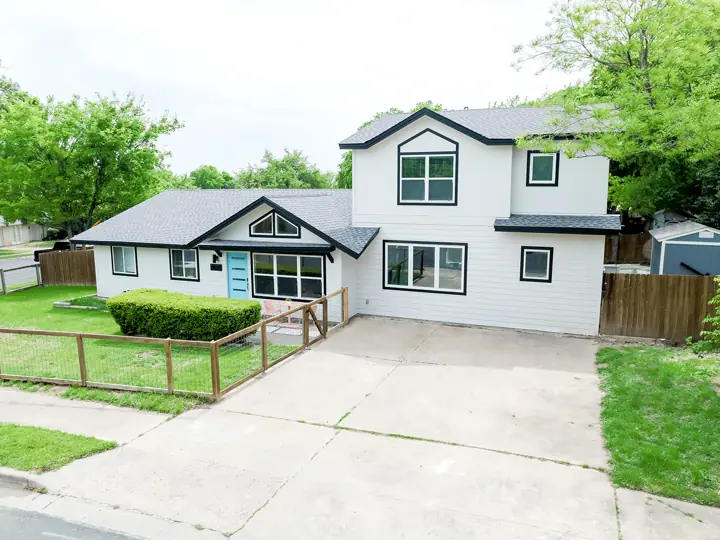 Exterior of a single-story home after a second-story addition and whole home remodel
