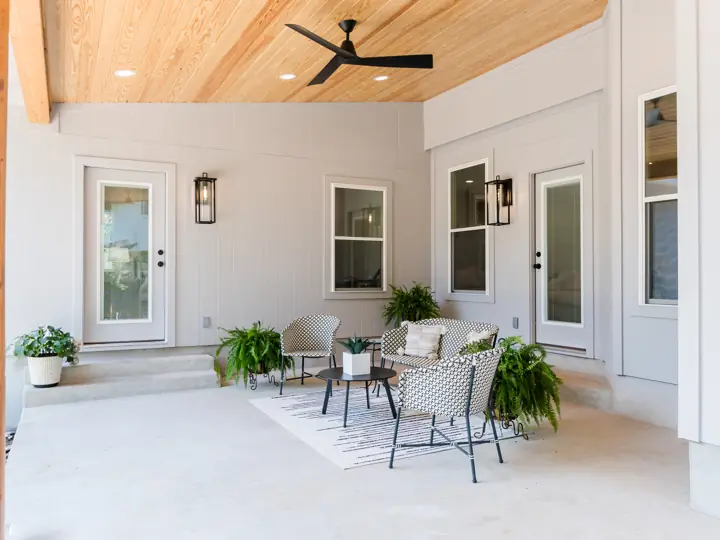Covered patio addition with wood ceiling and recessed lighting