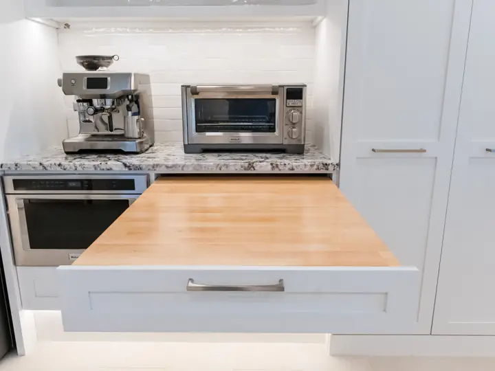 Accessible kitchen with pull-out butcher block work surface at wheelchair height
